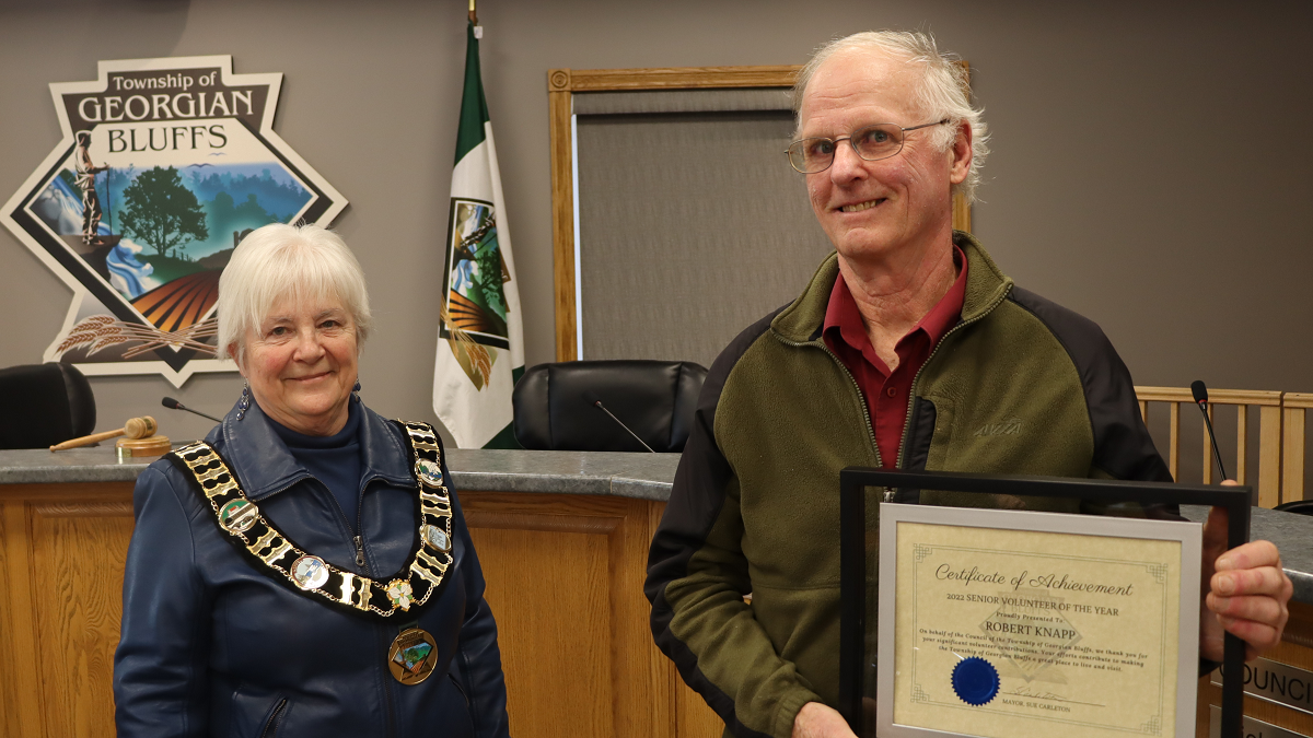 Mayor Carleton with Robert Knapp receiving Volunteer of the Year Award