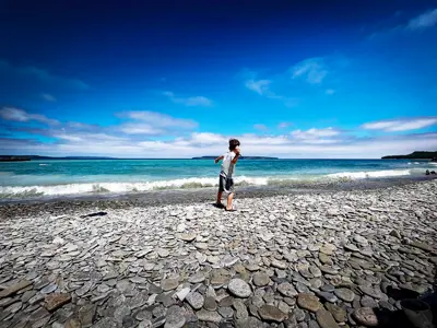 A kid skipping Stones