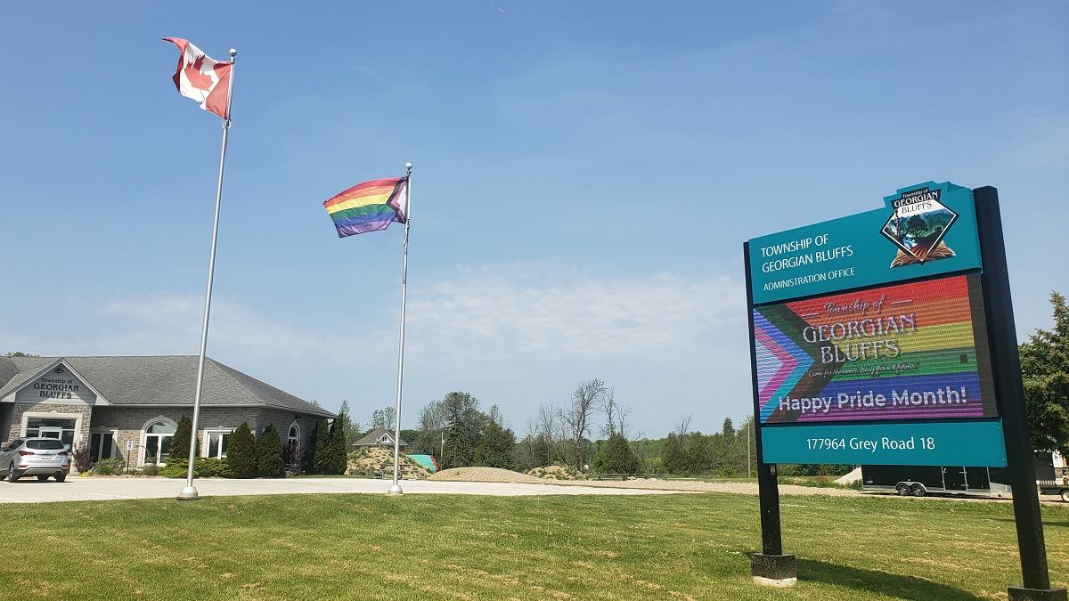 Rainbow flag flying in front of Township office.