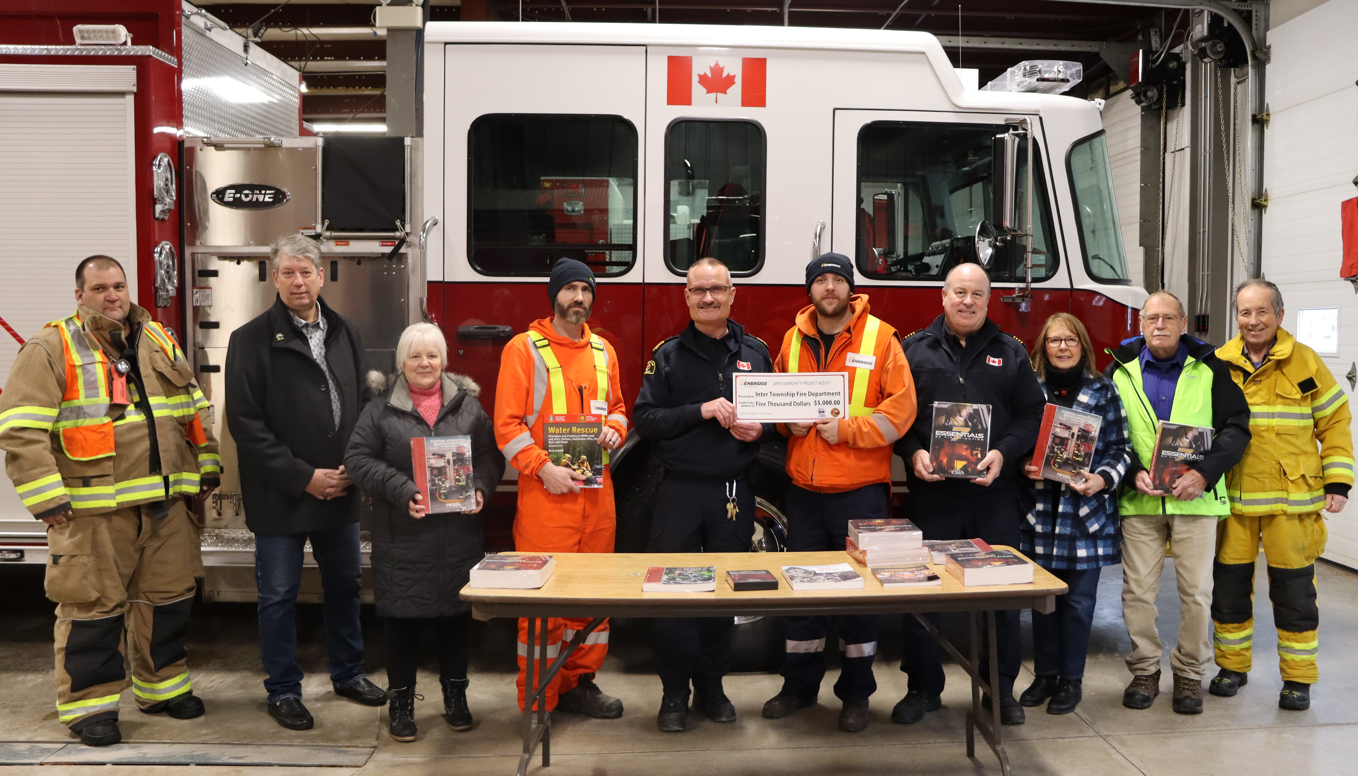 ITFD Staff receiving $5,000 cheque